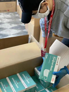 Technician packing serviced dental equipment carefully for delivery within the metropolitan area
