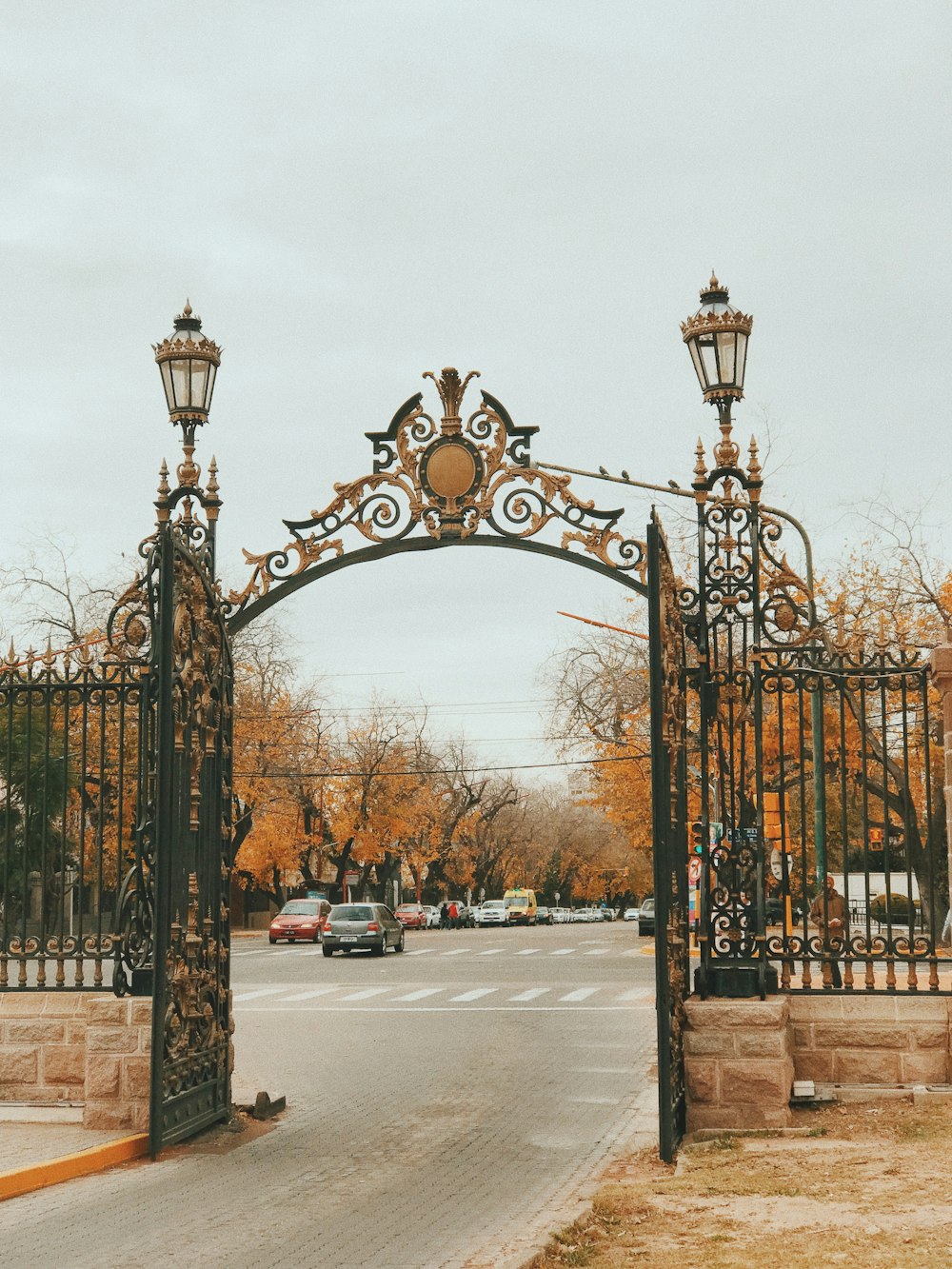 black metal gate near road during daytime