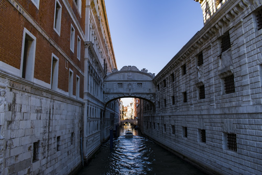 river between brown concrete buildings during daytime