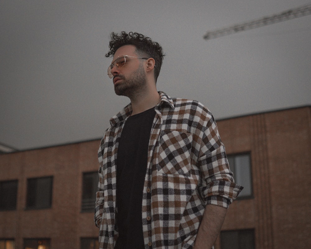 man in white black and brown plaid button up shirt