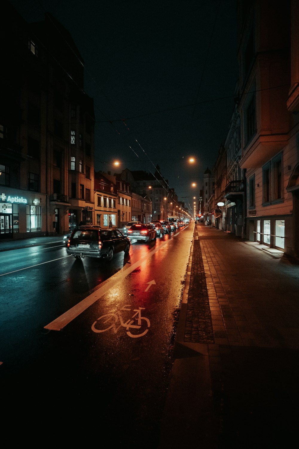 cars parked on side of the road during night time