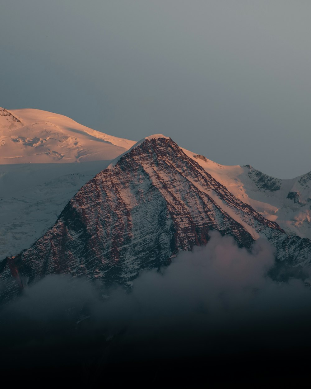 brown mountain covered with snow