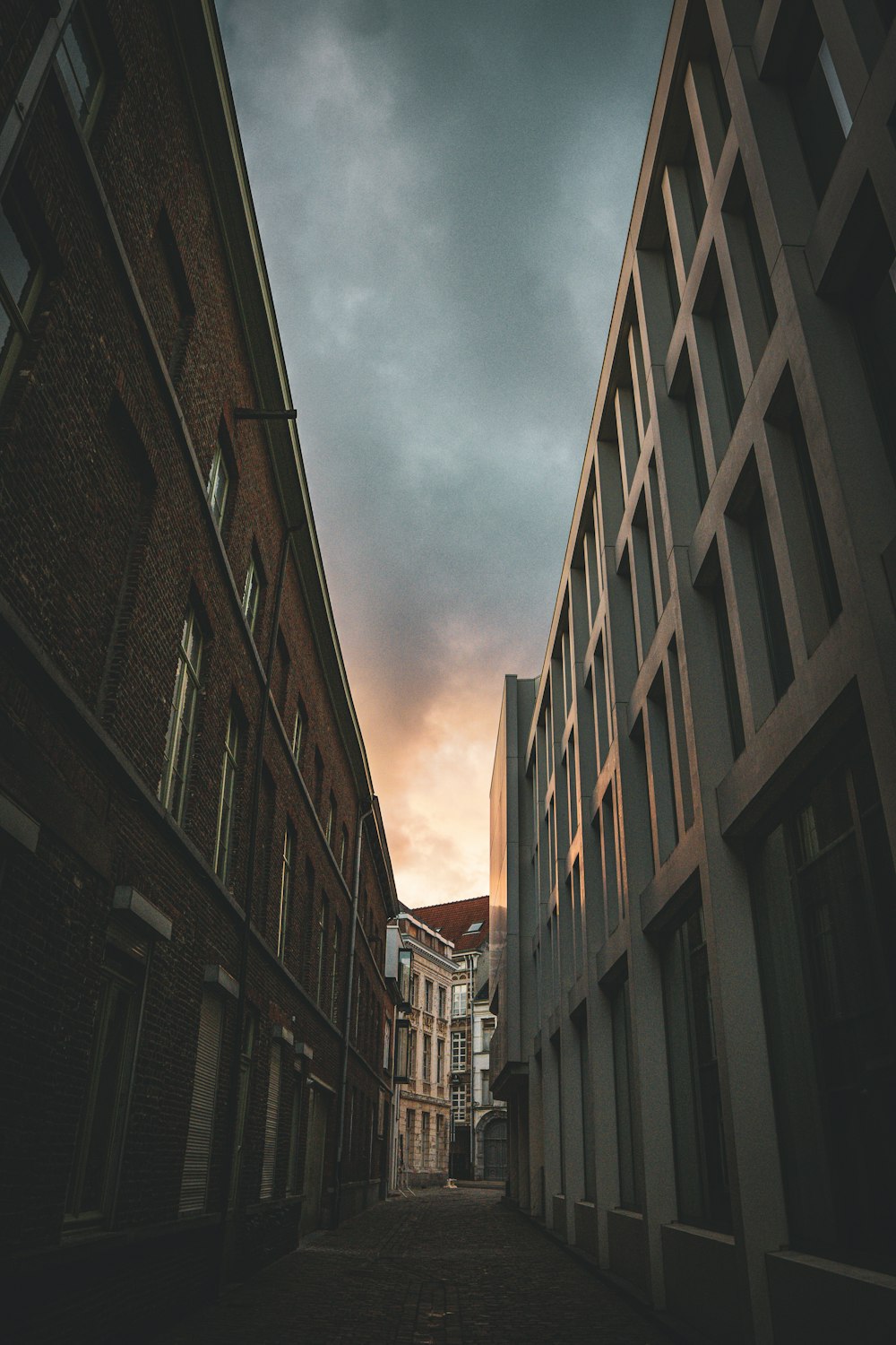 low angle photography of high rise buildings under cloudy sky during daytime