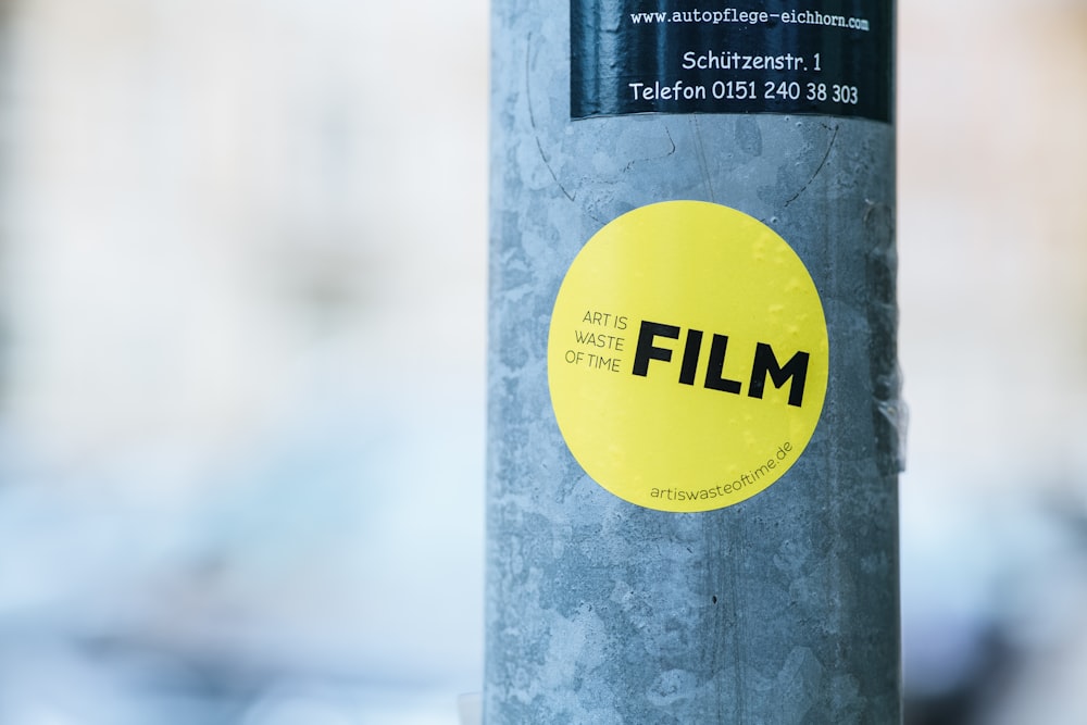 a close up of a sticker on a pole