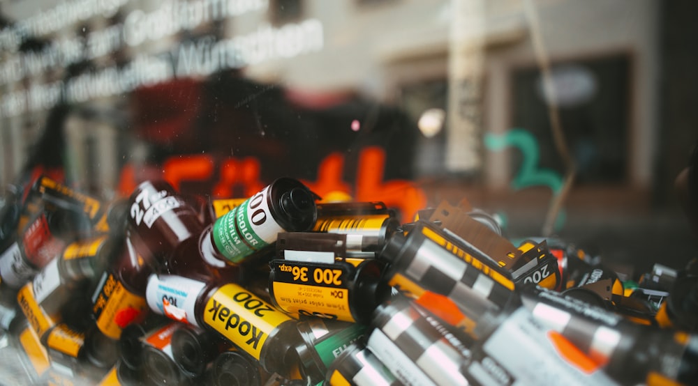 assorted bottles on glass shelf