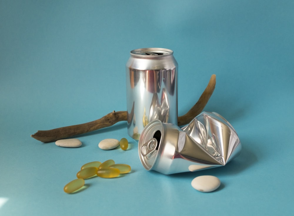 stainless steel vacuum flask on teal textile