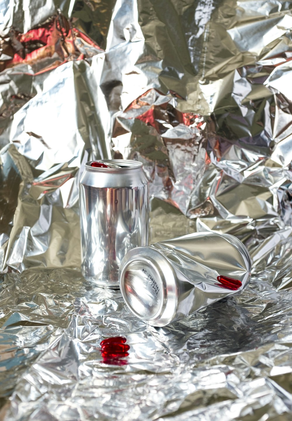 silver can on silver foil