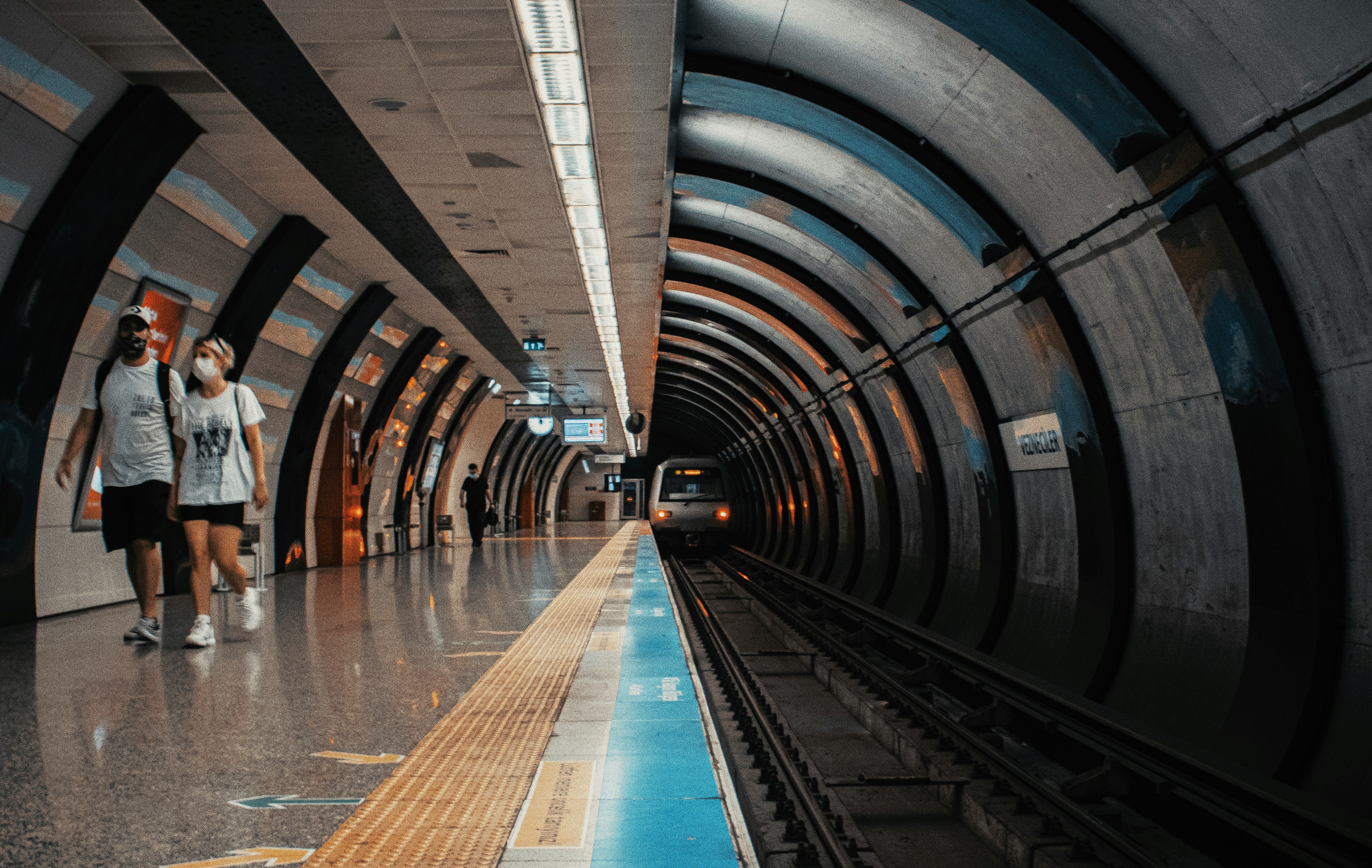 person walking on tunnel during daytime