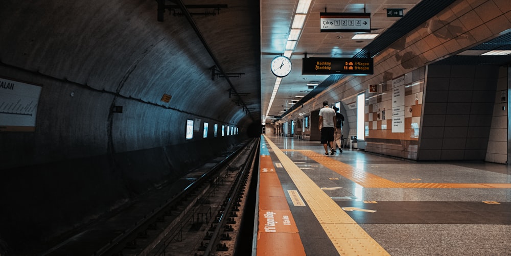 people walking on train station