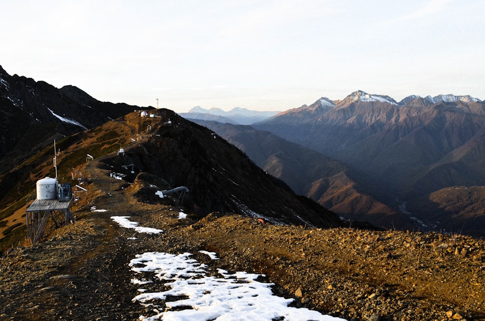 brown and green mountains under white sky during daytime