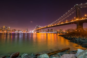 bridge over water during night time