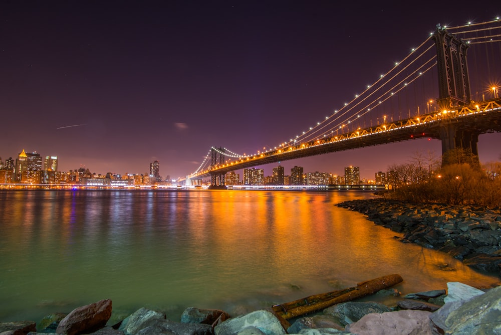 bridge over water during night time