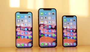 black iphone 7 plus on brown wooden table