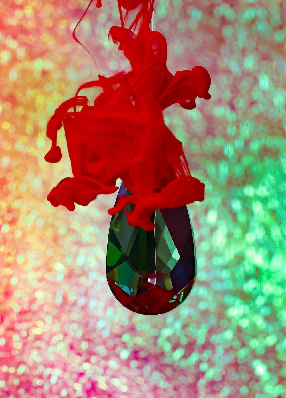 red rose with heart shaped glass ornament