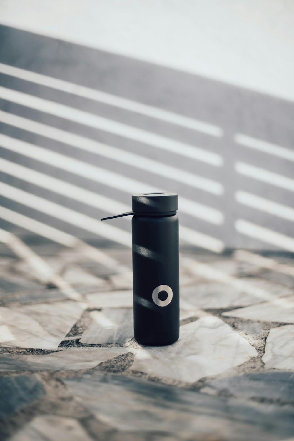 black and silver tube on brown wooden table