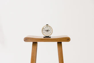 brown wooden table clock at 10 10