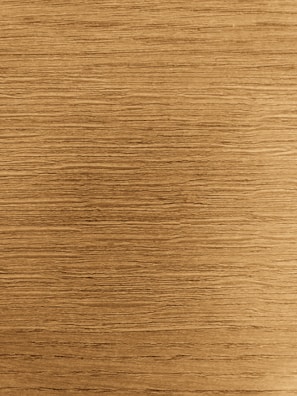 Close-up of a handcrafted wooden photo frame with natural grain texture.