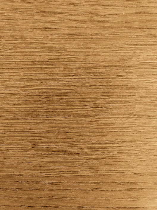 Close-up of a rustic wooden picture frame highlighting its natural grain and warm tones.