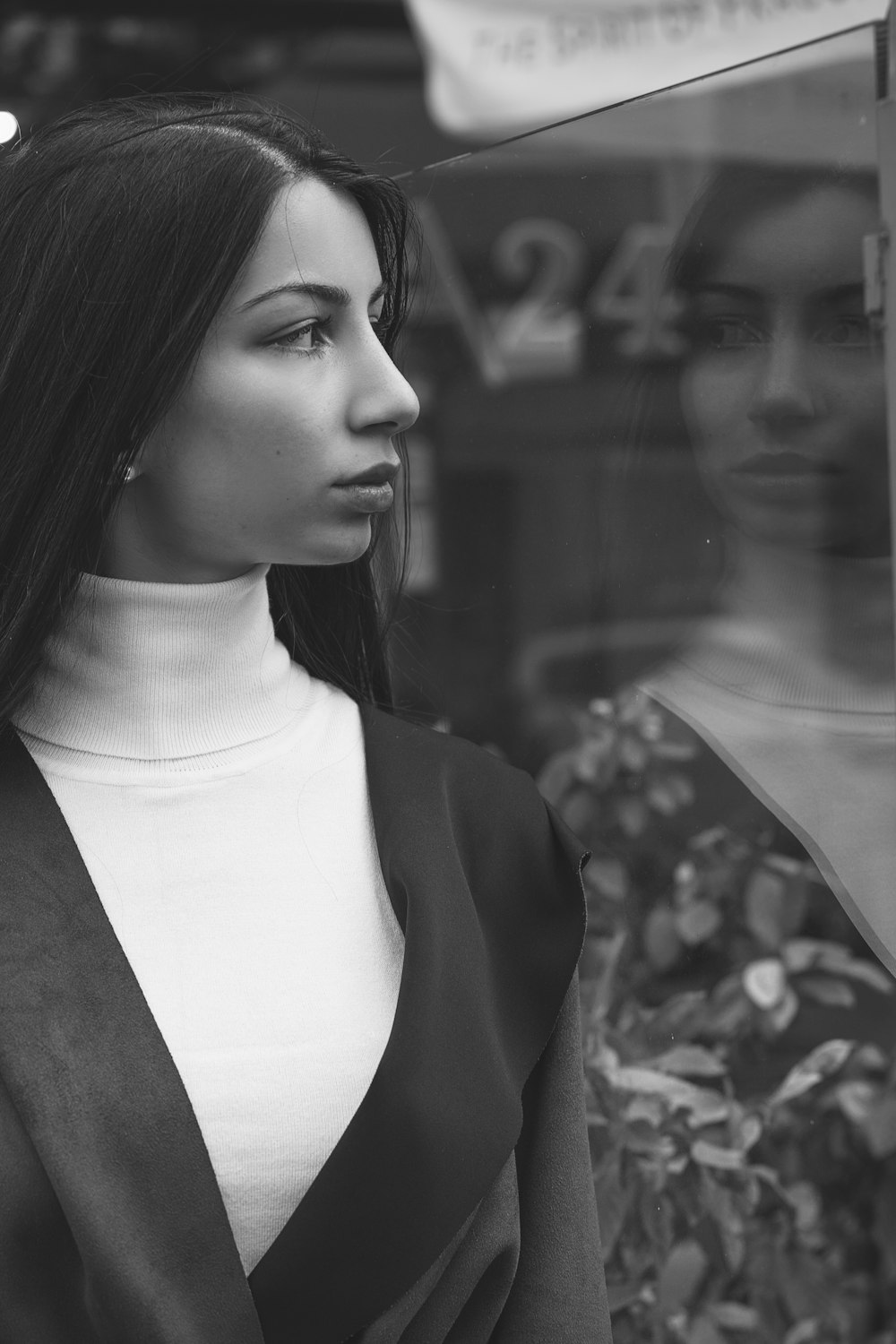 woman in black blazer in grayscale photography