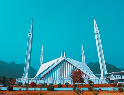 white and brown concrete building under blue sky during daytime