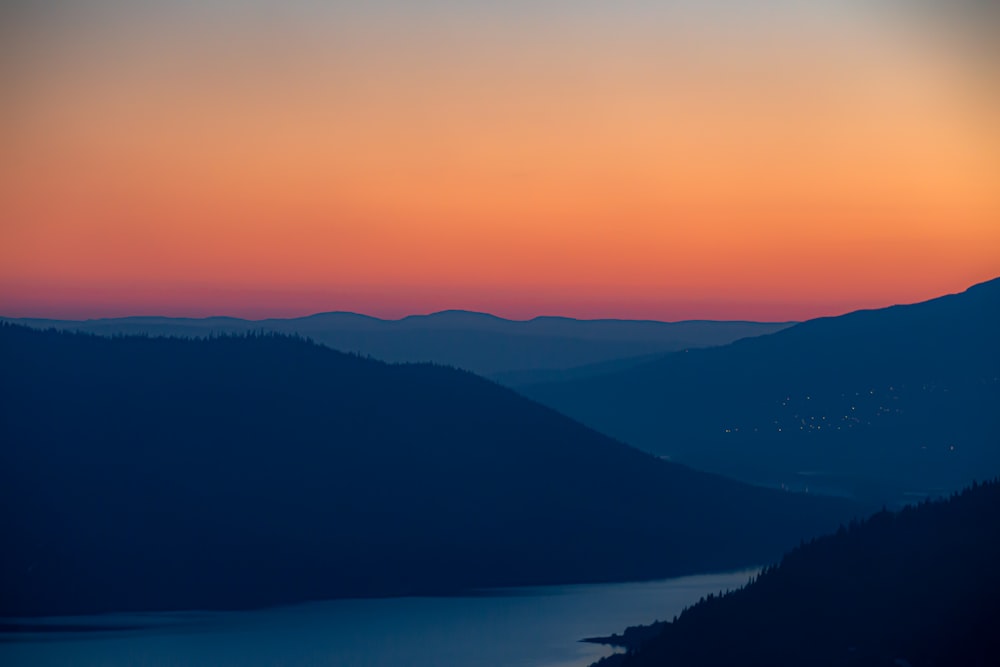 silhouette of mountains during sunset