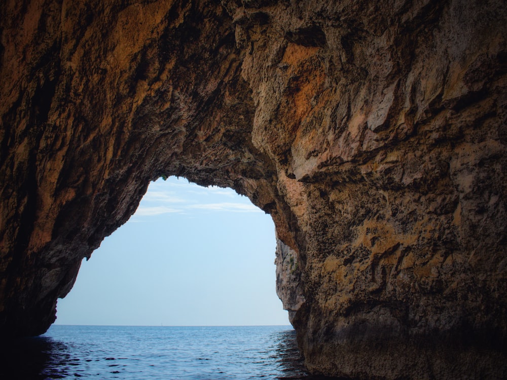 brown rock formation near sea during daytime