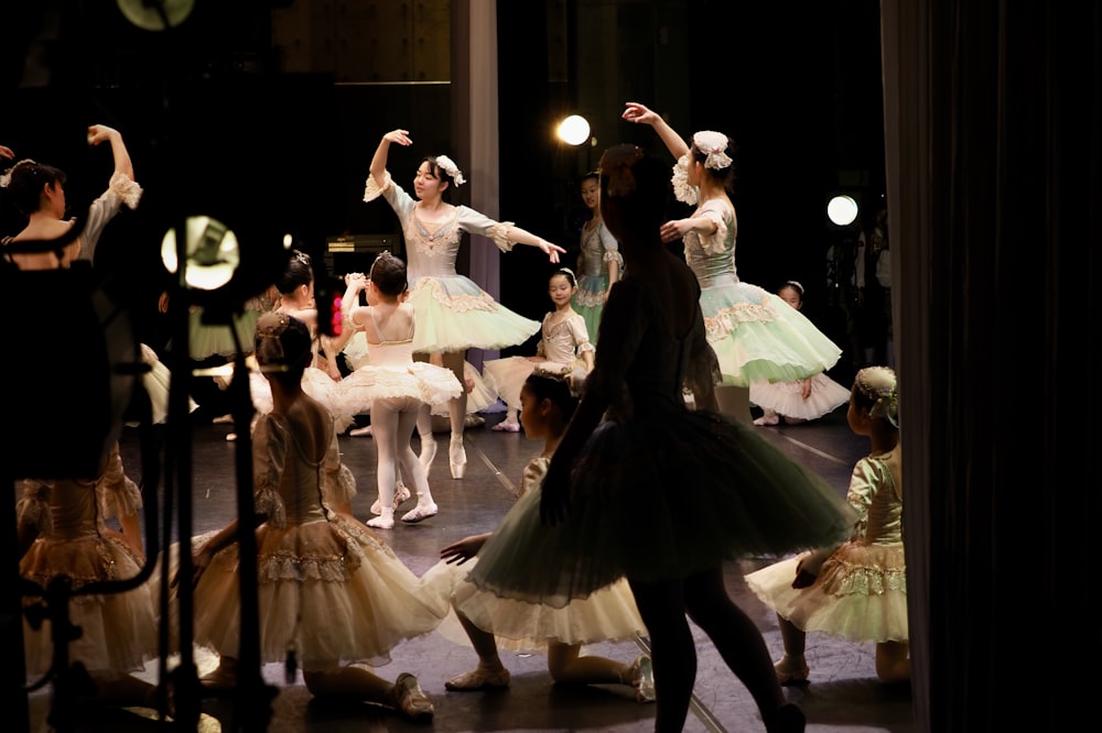 woman in white dress dancing on stage