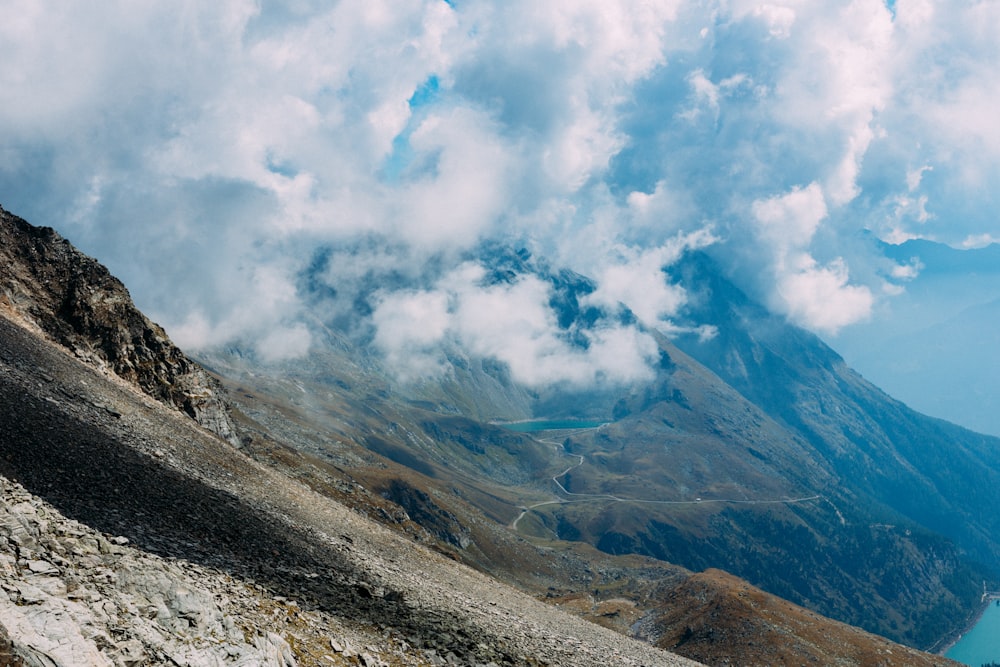 gray and brown mountain under white clouds during daytime