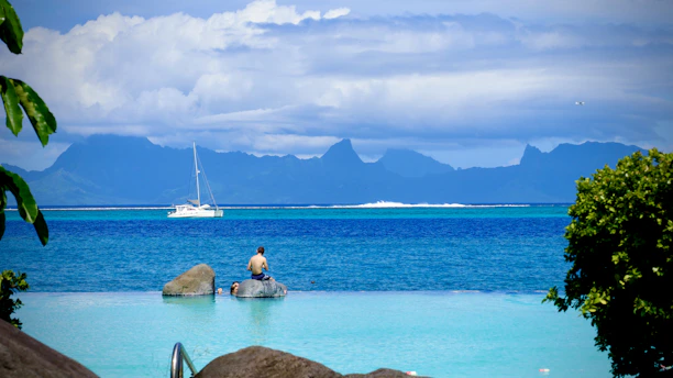 white sail boat on sea during daytime