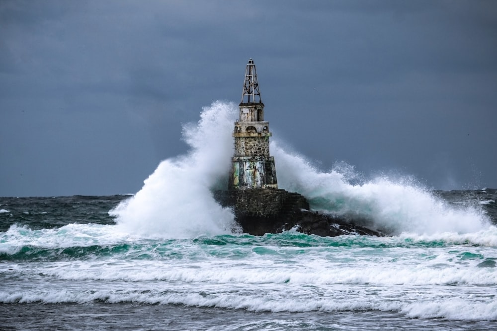 black and white tower on sea water