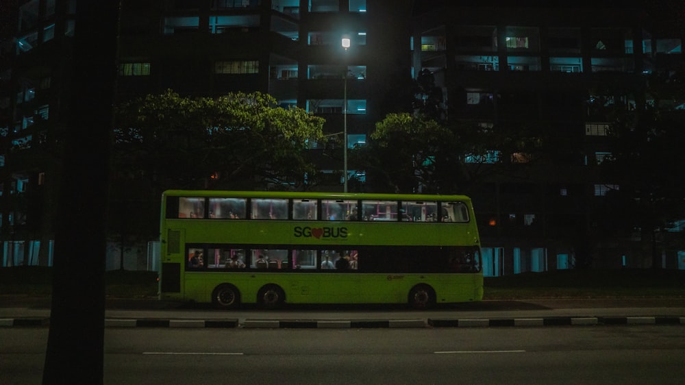 red and white bus on road during daytime