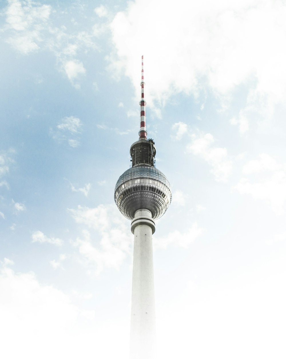 white and red tower under blue sky during daytime