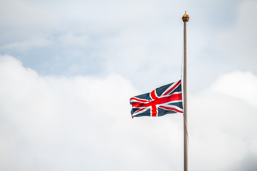 us a flag under white clouds, Union Jack at half mast
