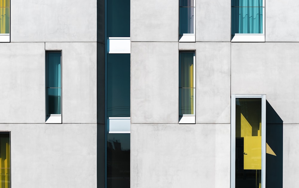 a building with multiple windows and a yellow door