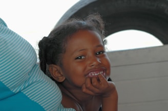 A smiling adolescent engaged in a supportive conversation with a caring therapist.