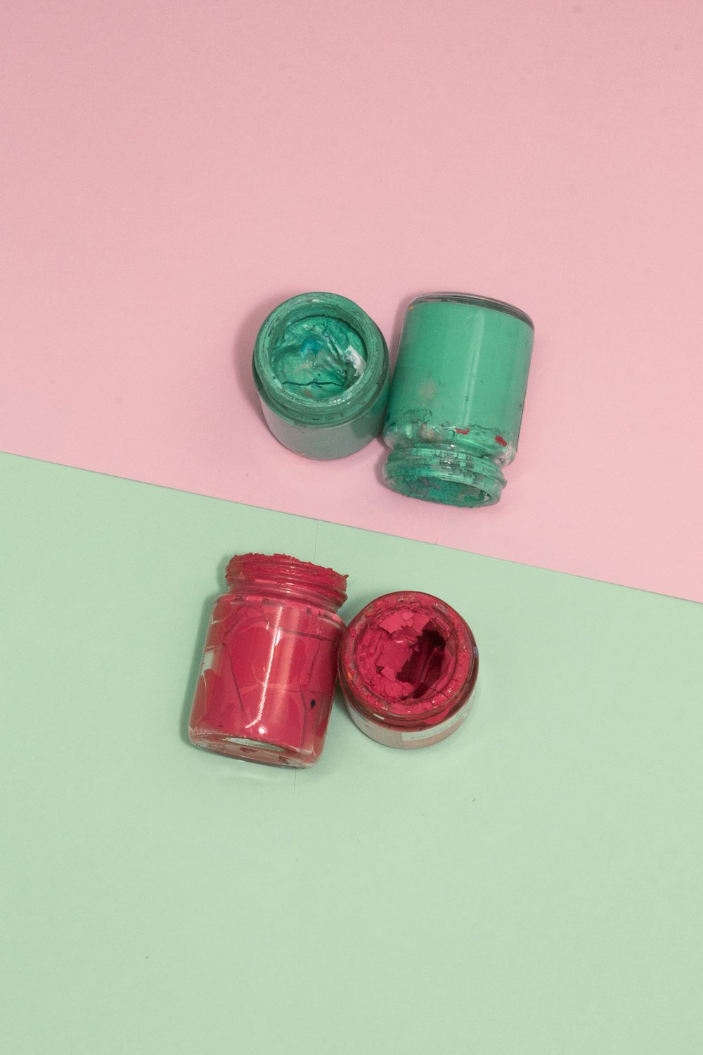 pink and green round plastic containers