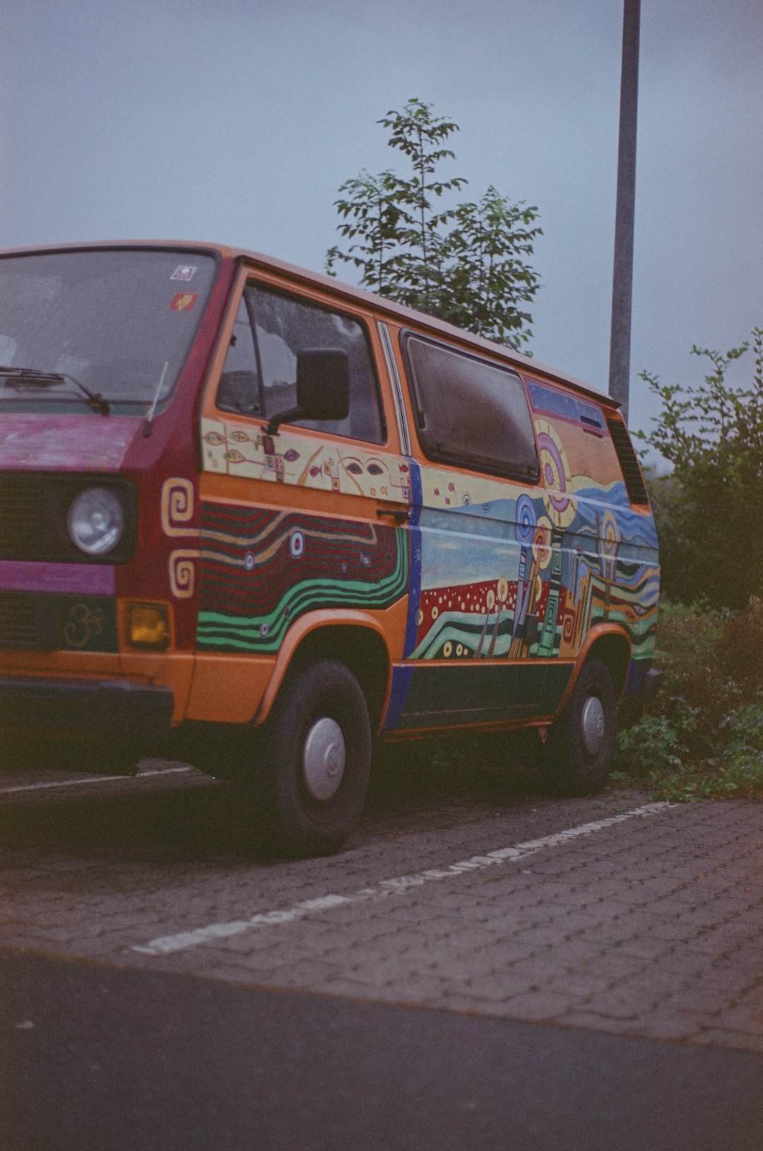 orange and blue van on road