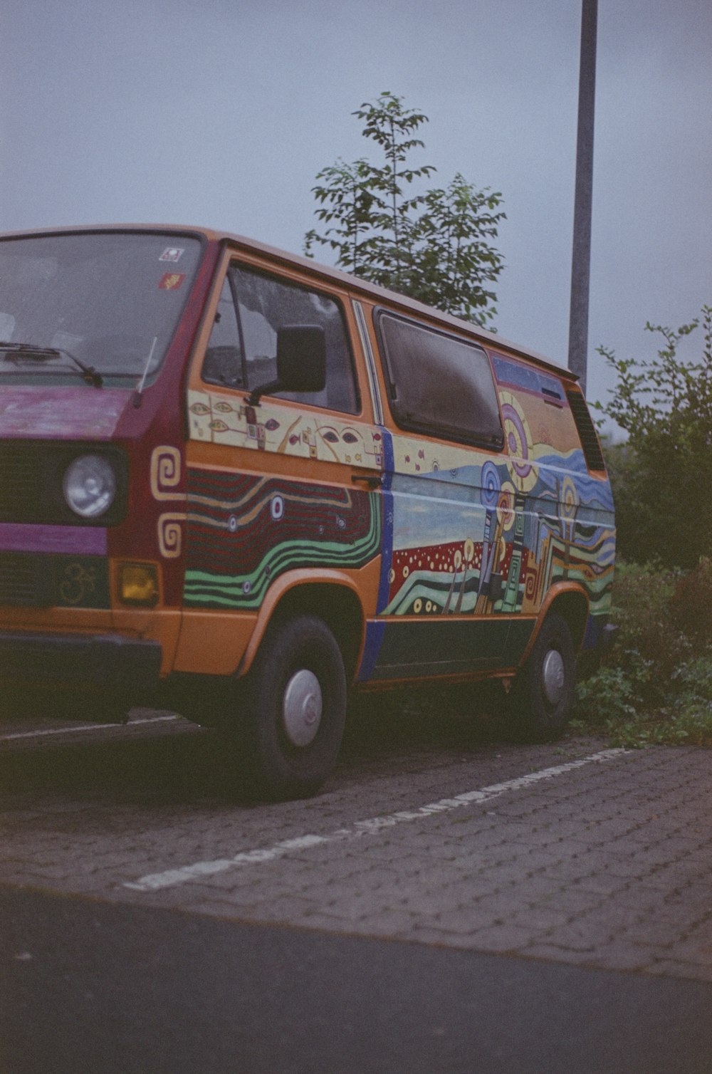 orange and blue van on road