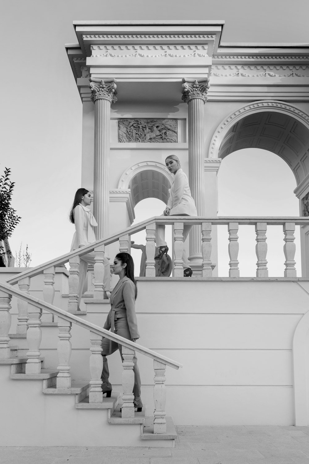 man and woman standing on white concrete building during daytime