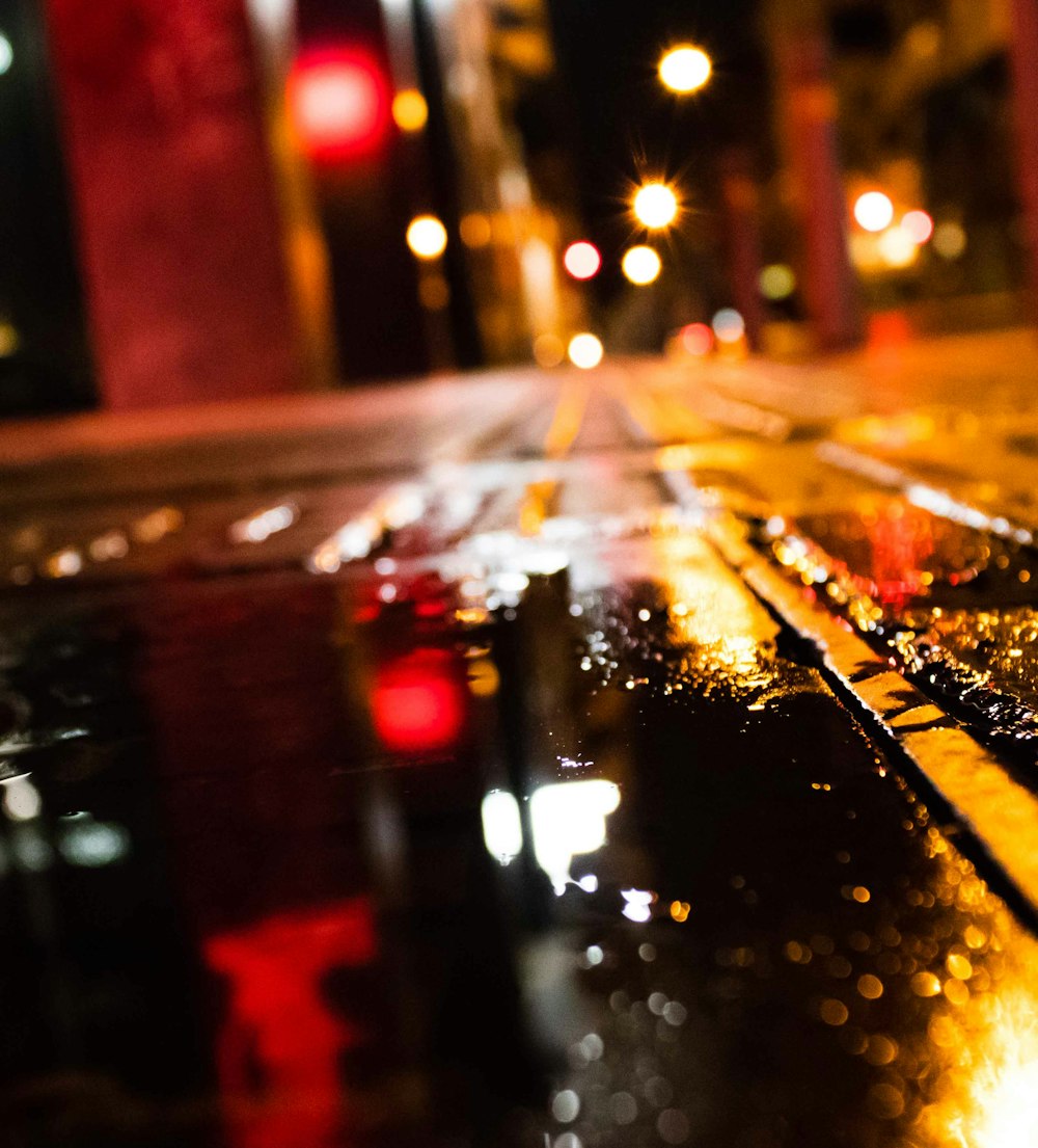 city street with cars during night time