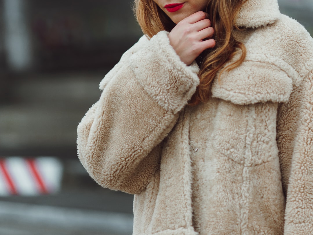 woman in beige fur coat