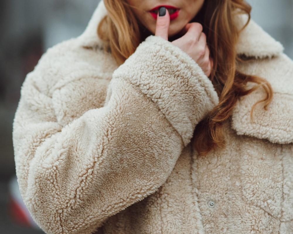 woman in white fur coat