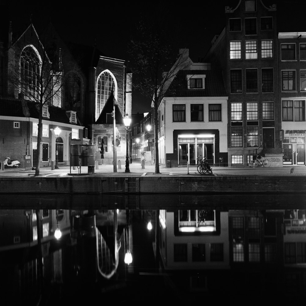 grayscale photo of building during night time