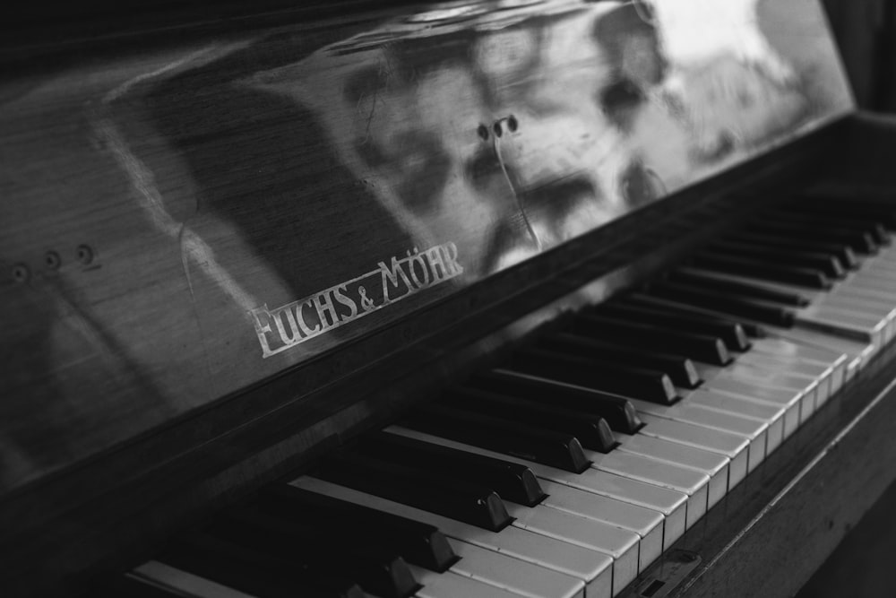 grayscale photo of piano keys