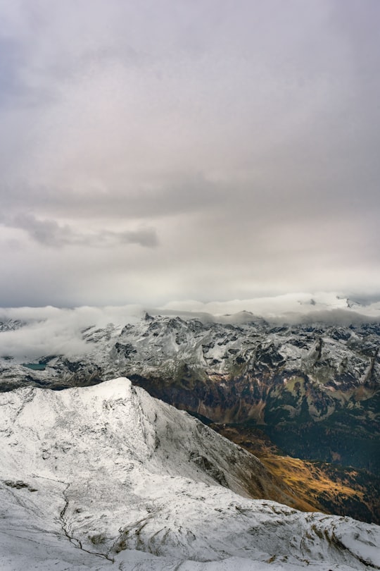 snow covered mountain under cloudy sky during daytime in Kitzsteinhorn Austria