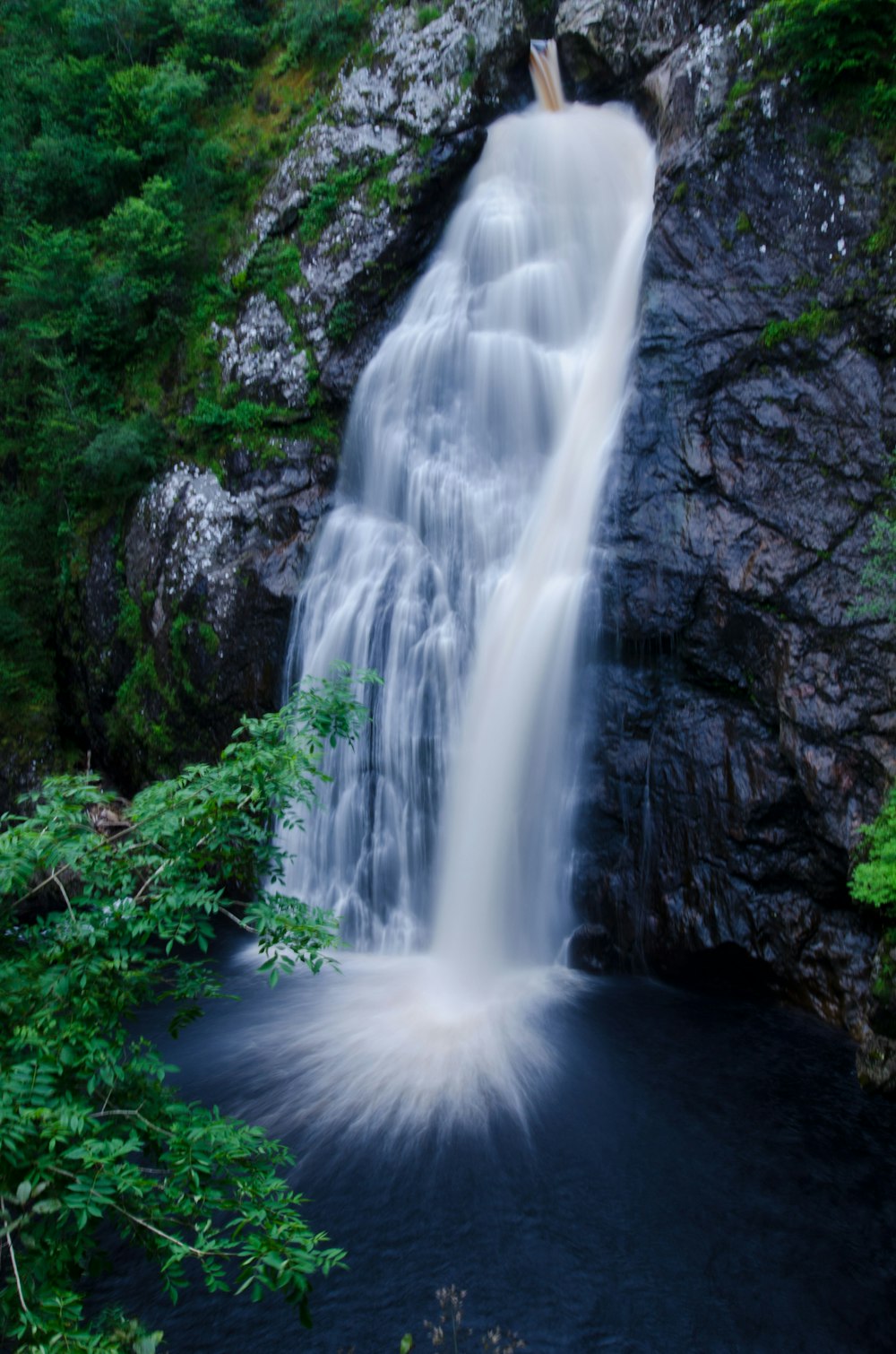 waterfalls in the middle of the forest