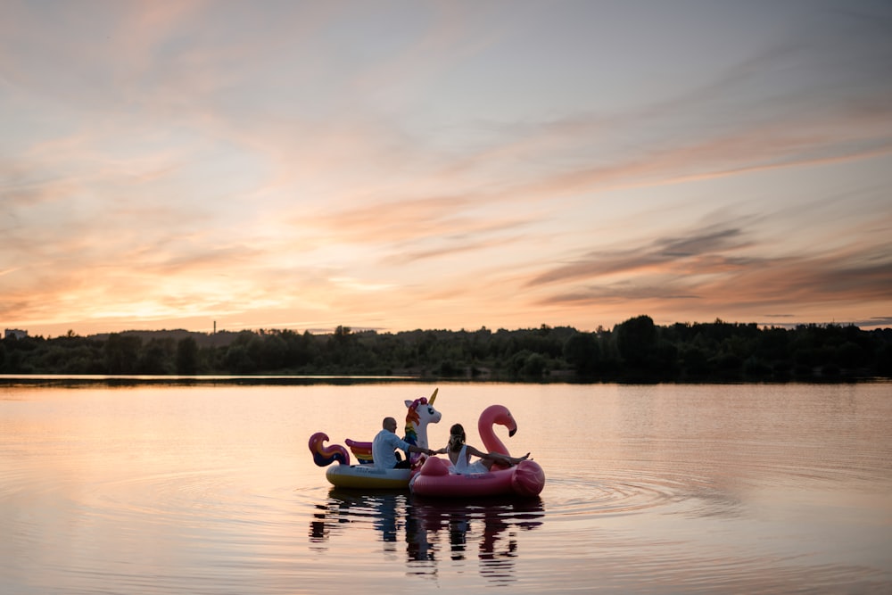 2 people riding on kayak on lake during daytime