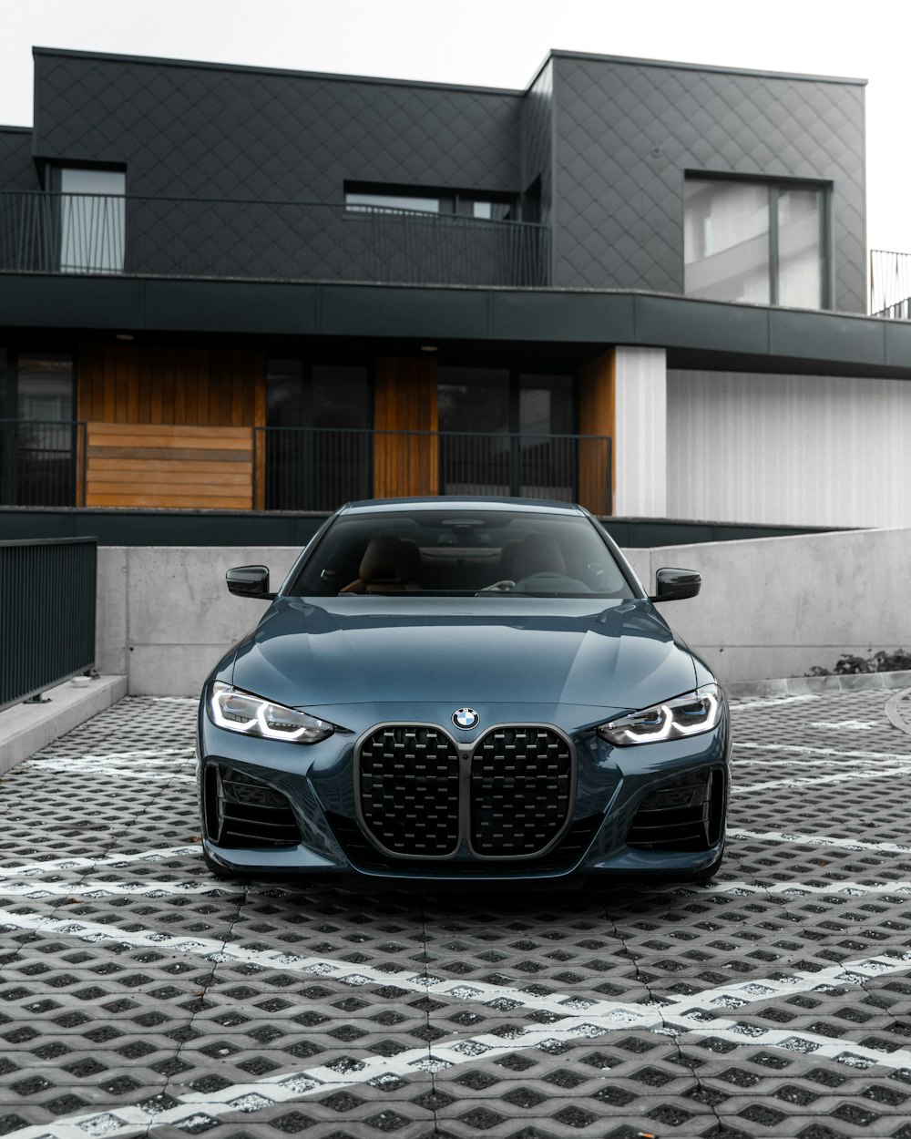 black bmw m 3 parked on gray concrete pavement during daytime