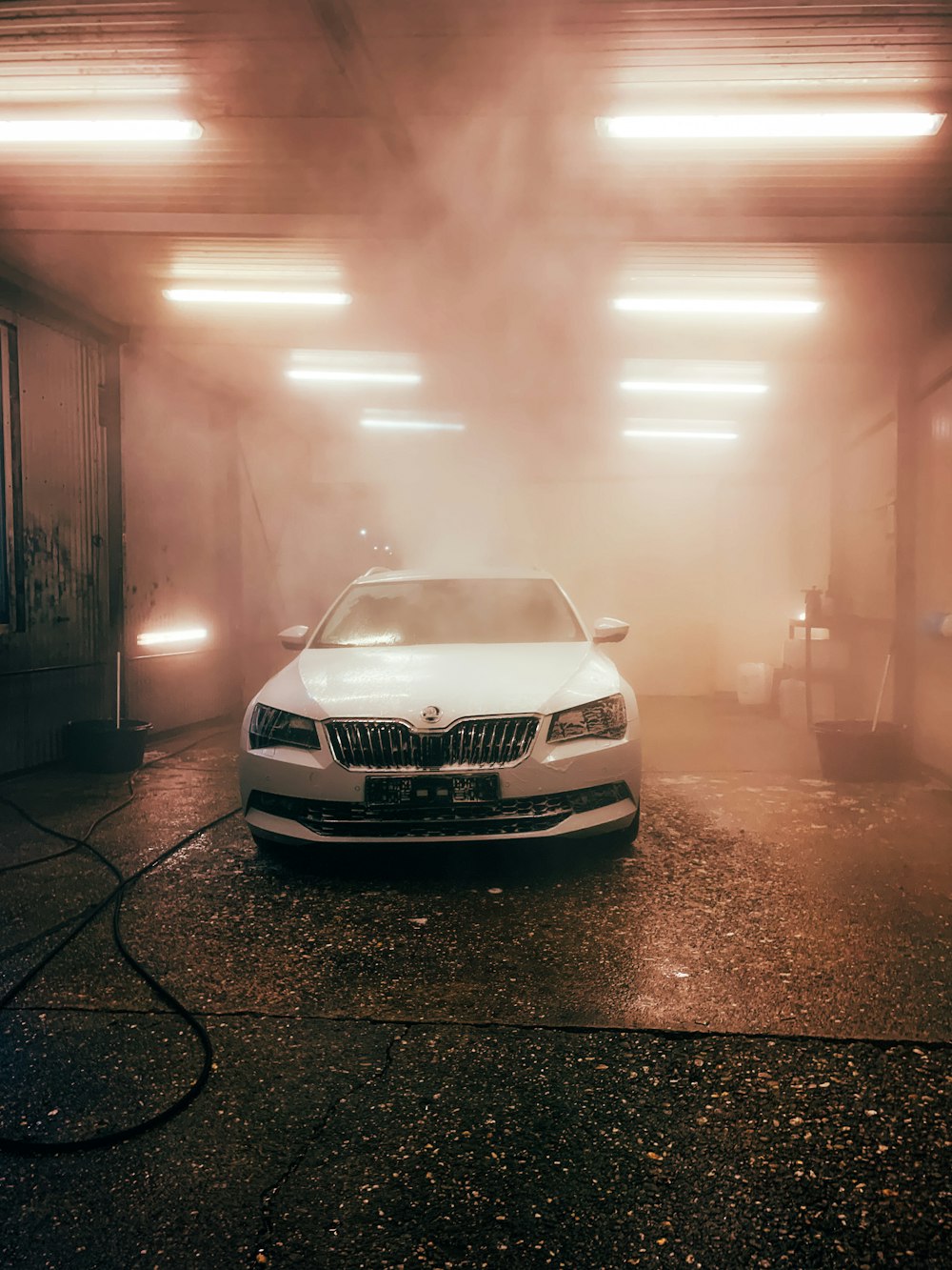 white bmw car on road during daytime