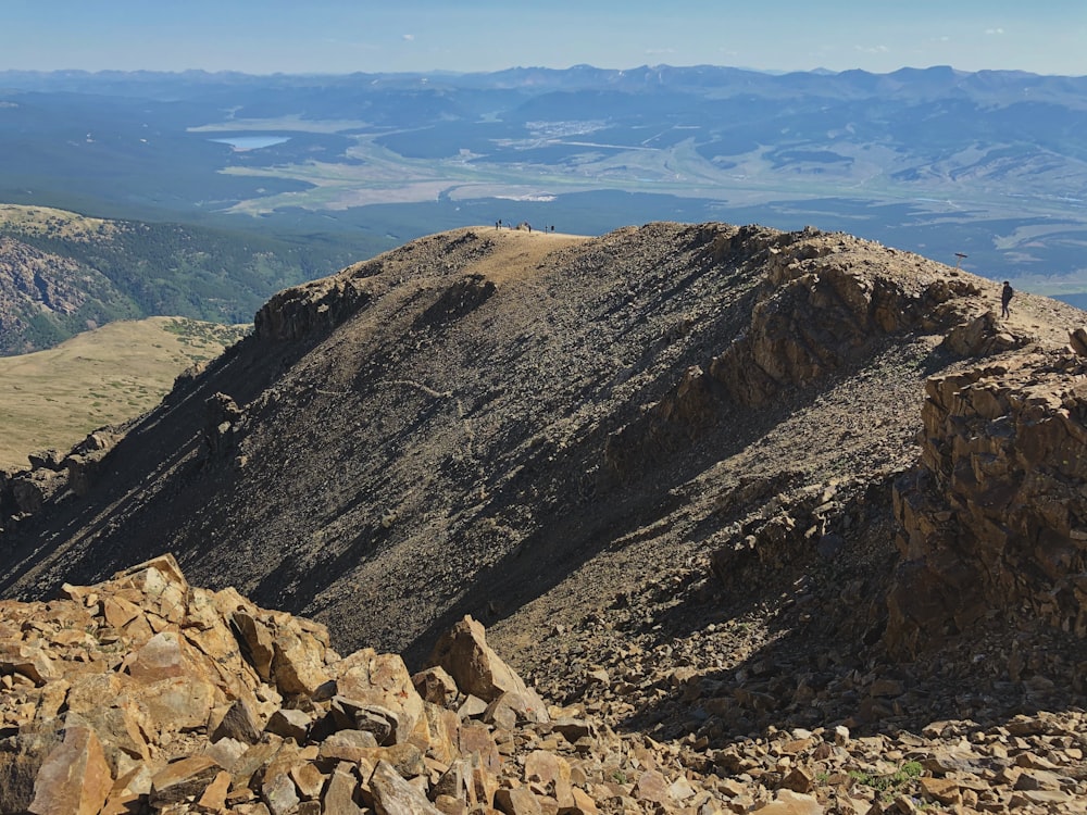 brown rocky mountain under blue sky during daytime